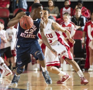 Senior guard Greg Gantt protects the ball. He finished with 22 points. Photo by Western Kentucky University Media Relations.