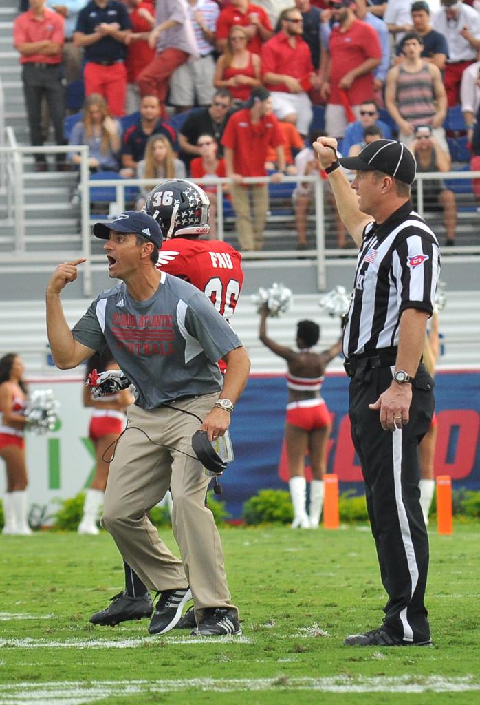 Interim Head Coach Brian Wright coaches the owls to victory from the sidelines. Photo by Michelle Friswell
