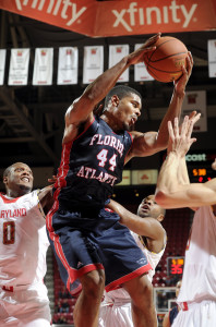 Kelvin Penn snatches a rebound in traffic. Photo by Greg Fiume