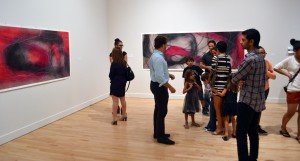 Art fans browse the works of the 2013 Biennial Faculty Art Exhibition during the show's opening on Sept. 20 in the Schmidt Center Gallery. The exhibition runs through Dec. 7 in the Schmidt Center Gallery and Nov. 9 in the Ritter Art Gallery. Photo by David Matthewman.