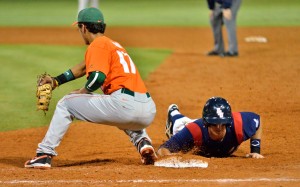  First baseman Mark Nelson slides back to first to avoid being picked off. The Owls lost to Miami 5-4 Wednesday night. Photo by Ryan Murphy.