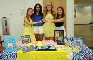 Representatives of Alpha Xi Delta. Chapter President Allie Wessel, Lena Sharff, Membership Vice President Morgan Donnelly, and Demi McGinn. Photo by Tami Lacoste.