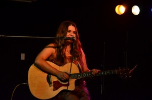 Erica Morgan plays at Hoot/Wisdom Recordings Red Album Concert Thursday night in The Burrow Bar and Grill. Photo by Max Jackson.