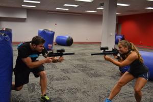 Luke Otfinowski, senior exercise science major and Victoria Oakley, senior exercise science major square off and prepare for battle. Photo courtesy of Austen Erblat.