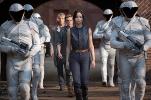 Haymitch Abernathy (Woody Harrelson, left), Peeta Mellark (Josh Hutcherson, center), Katniss Everdeen (Jennifer Lawrence, right) in The Hunger Games: Catching Fire. Photo by Murray Close/Lionsgate