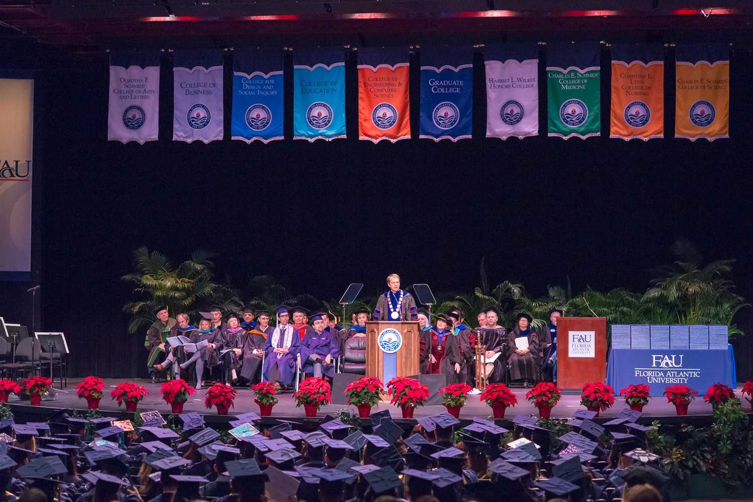 Group of graduating FAU students cross the stage University Press